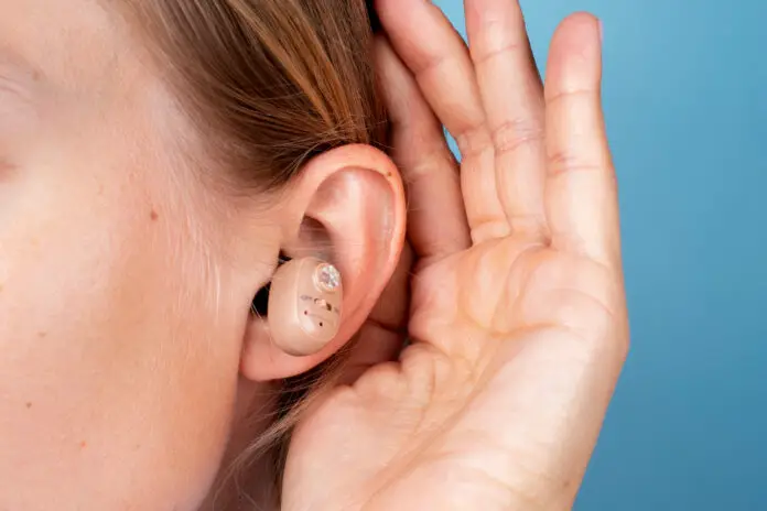 woman wearing hearing aids side view
